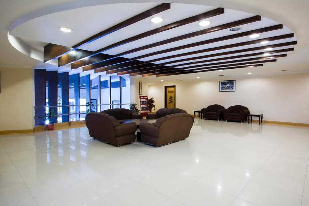 Lobby seating beneath a curved ceiling