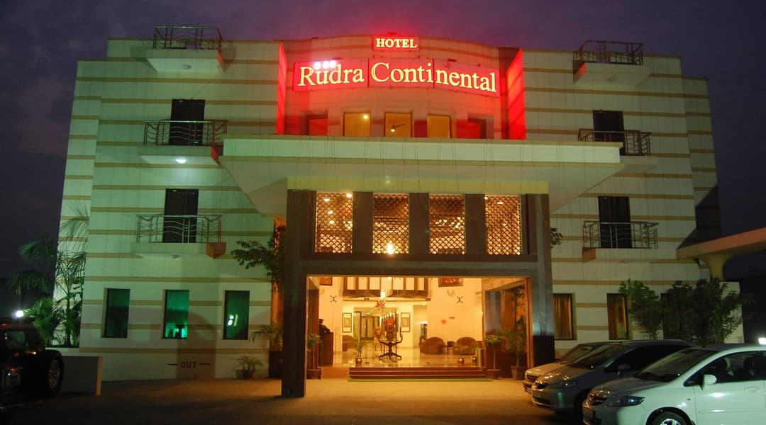 The hotel facade lit up at night